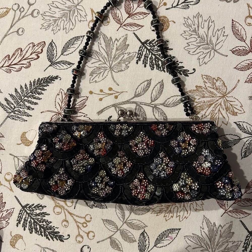 Bejeweled sequined small evening bag.  10” L 4” W opens 5”.  Beads and c…
